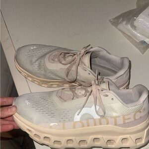 On Running Gray and Cream Athletic Shoes with Cloud Cushioning